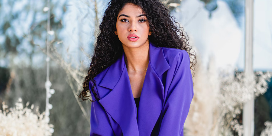 Woman in a bright, purple blazer