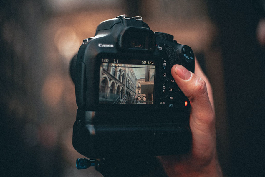 A DSLR digital camera taking a picture of scenery