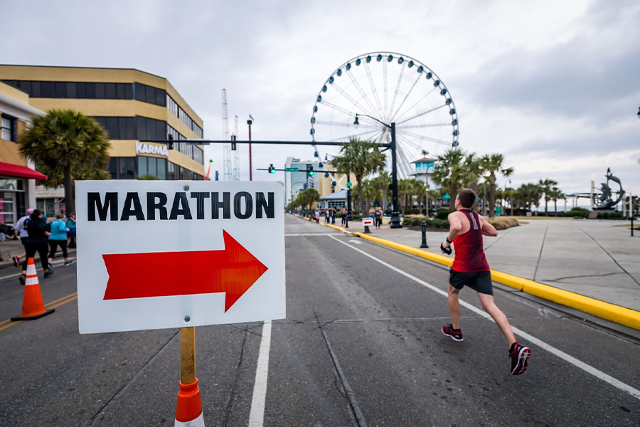 A marathon runner in red running shoes