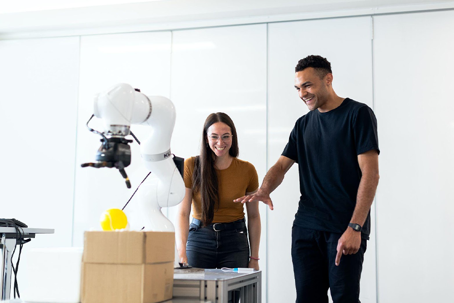 Individuals interacting with an industrial robot