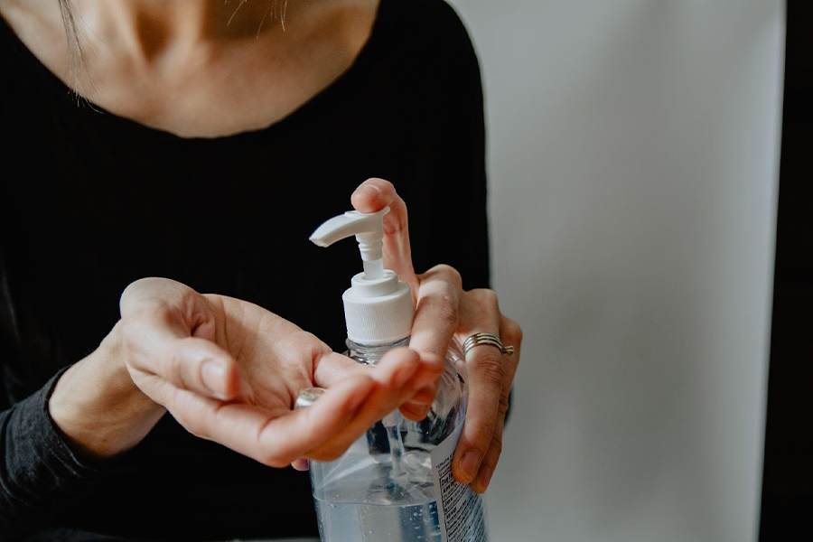 Person sanitizing their hands