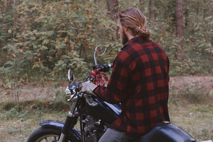 Man on a bike with an armored long sleeve shirt