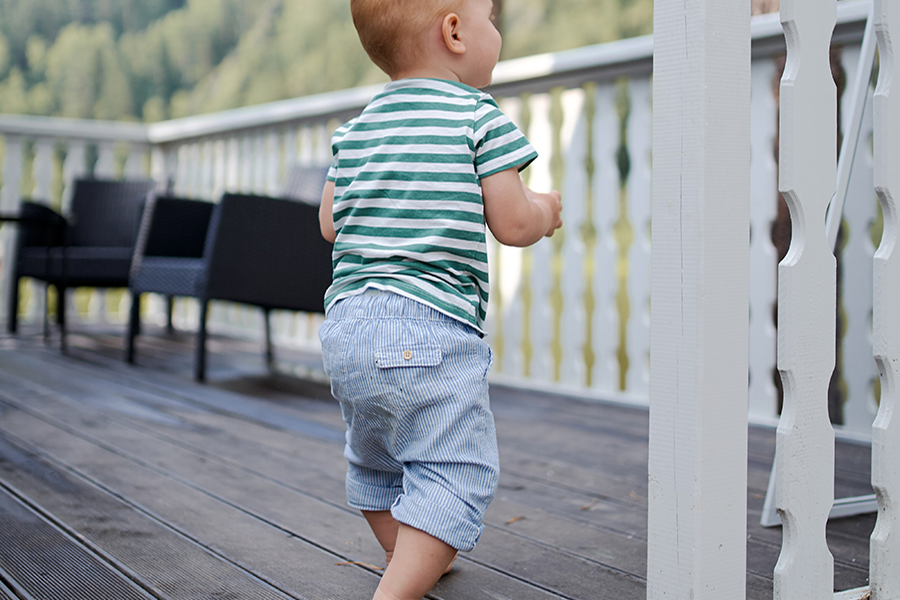 Toddler rocking a green and white striped shirt