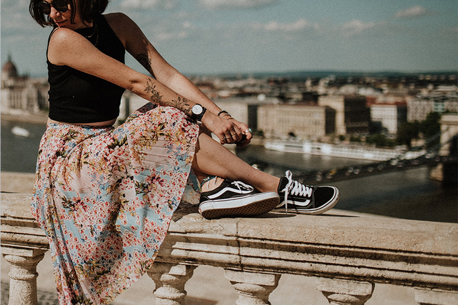 Lady in black top and bohemian high-waist skirt