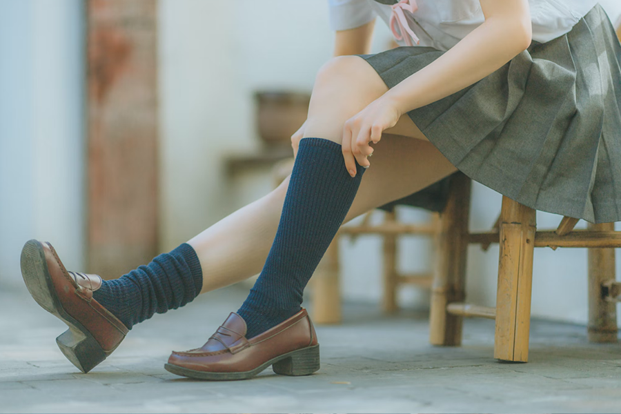 Woman pulling up calf socks