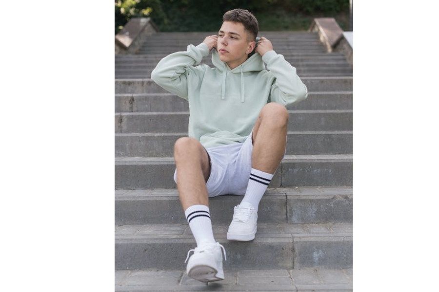 Young man wearing a hooded sweatshirt