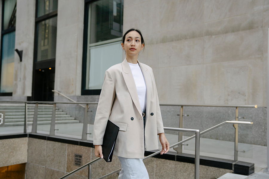 Asian lady in an oversized jacket and boyfriend jeans