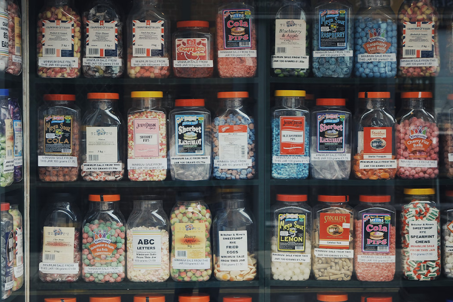 Assorted candies in large containers