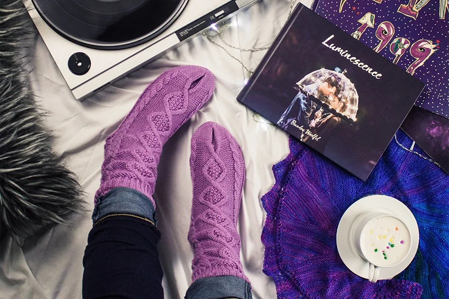 A woman wearing purple color socks 