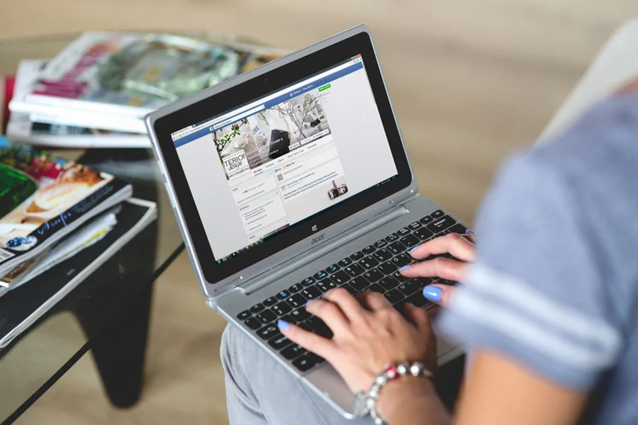 Female hands typing on a laptop