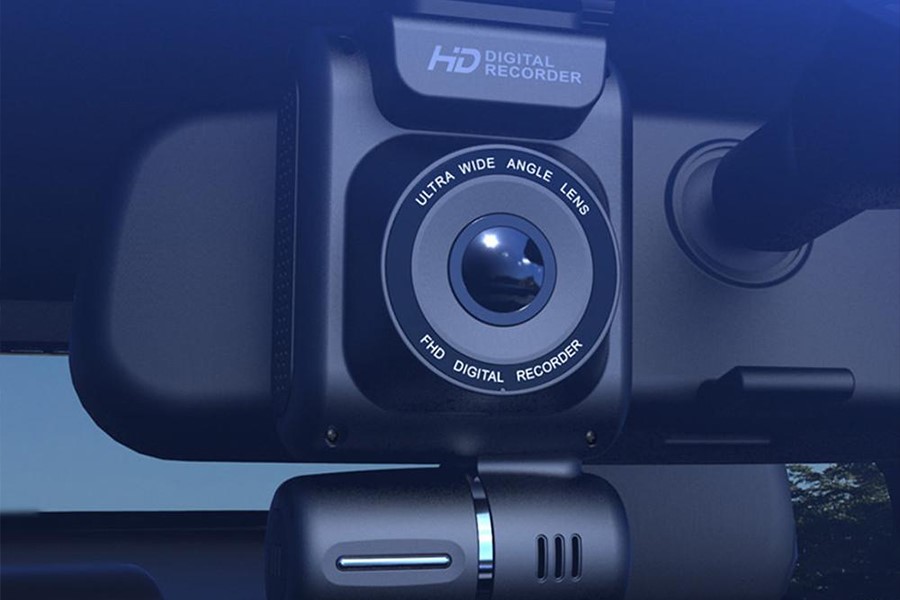 Mini dashcam behind a rearview mirror