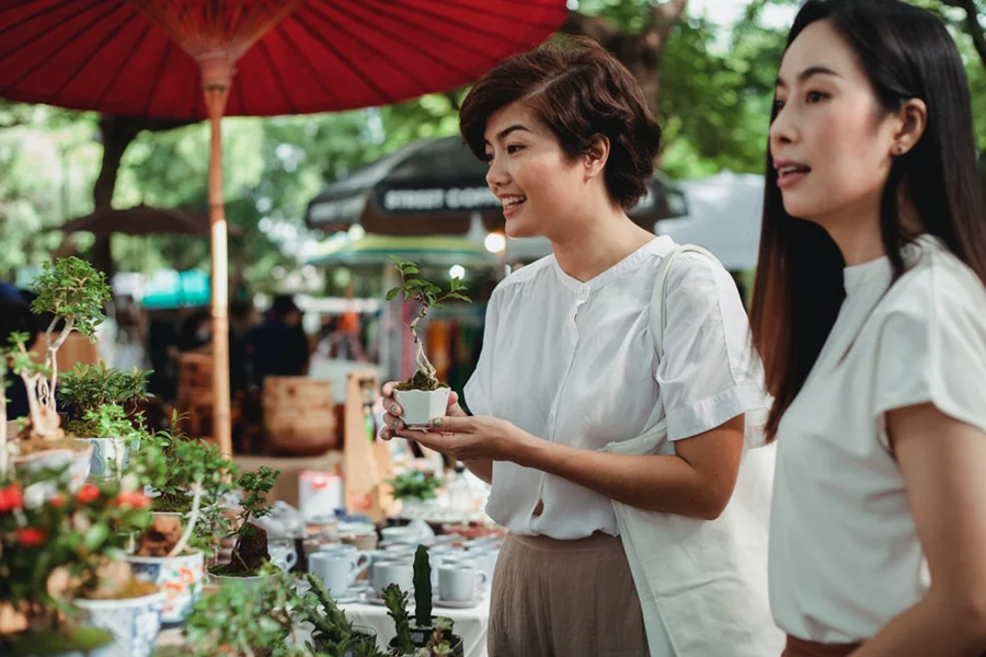 Two beautiful Asian women shopping locally