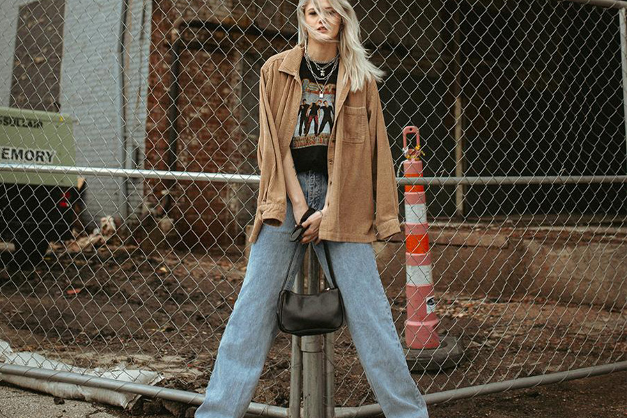 Beautiful blonde lady rocking loose jeans and brown jacket