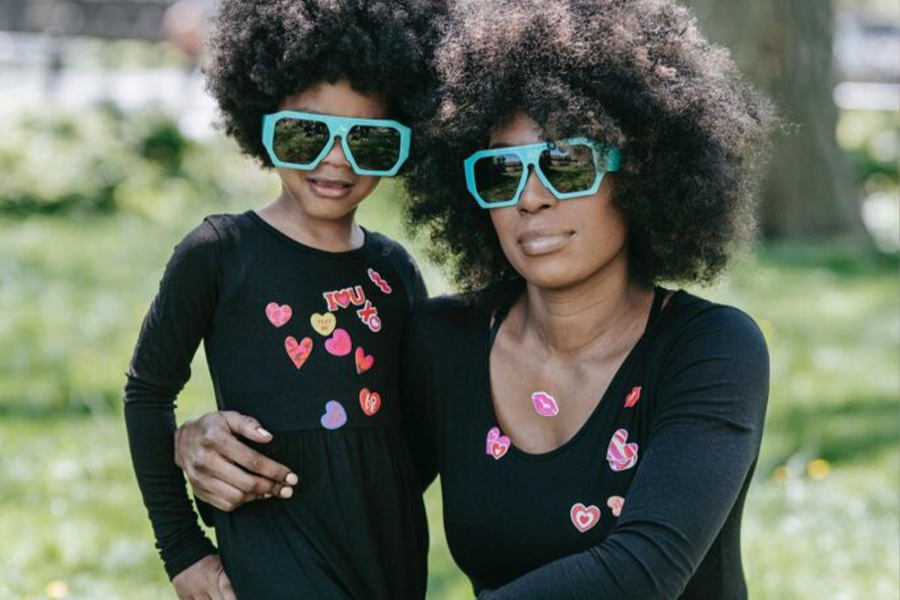 Mother And Daughter Wearing Matching Black Dresses