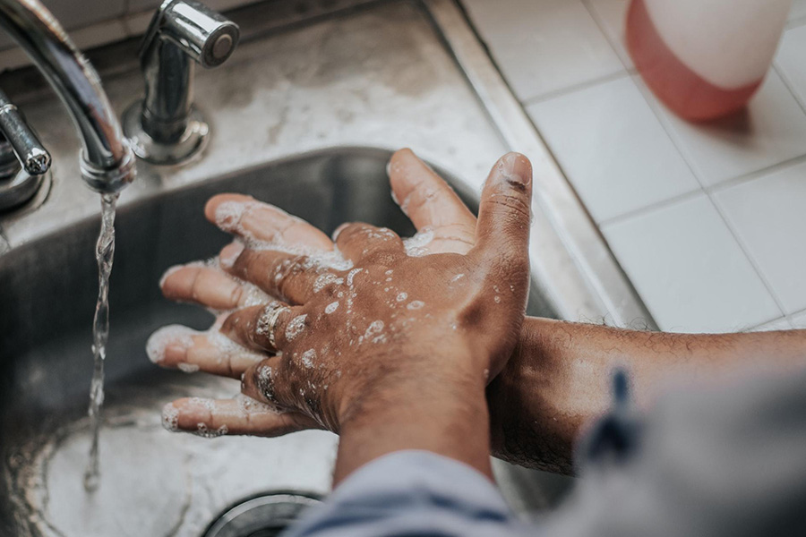 Person washing their hands with antibacterial soap