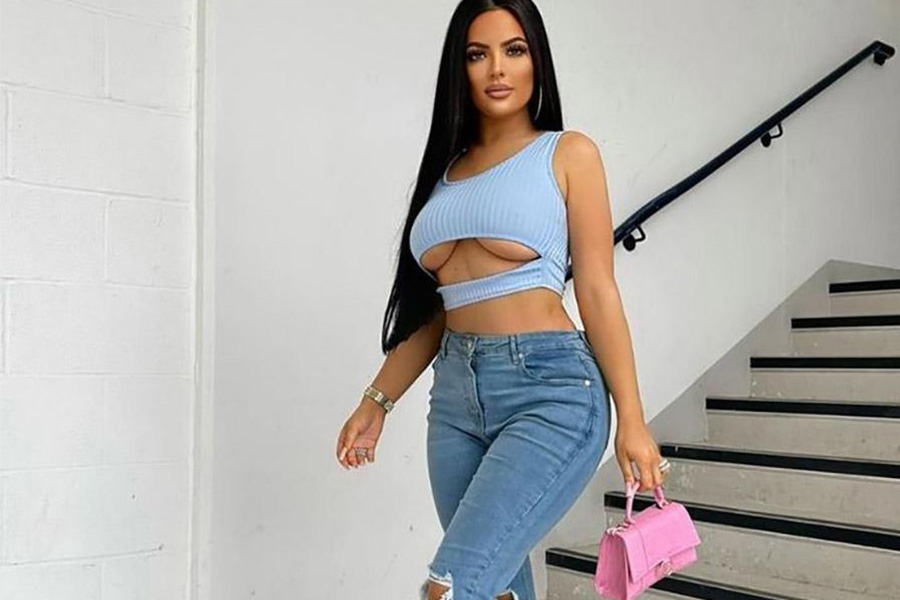 Beautiful woman wearing a light blue cutout knit top