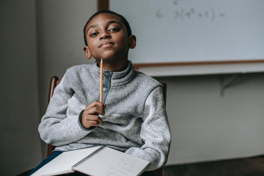 Boy in a gray and white half-placket sweater