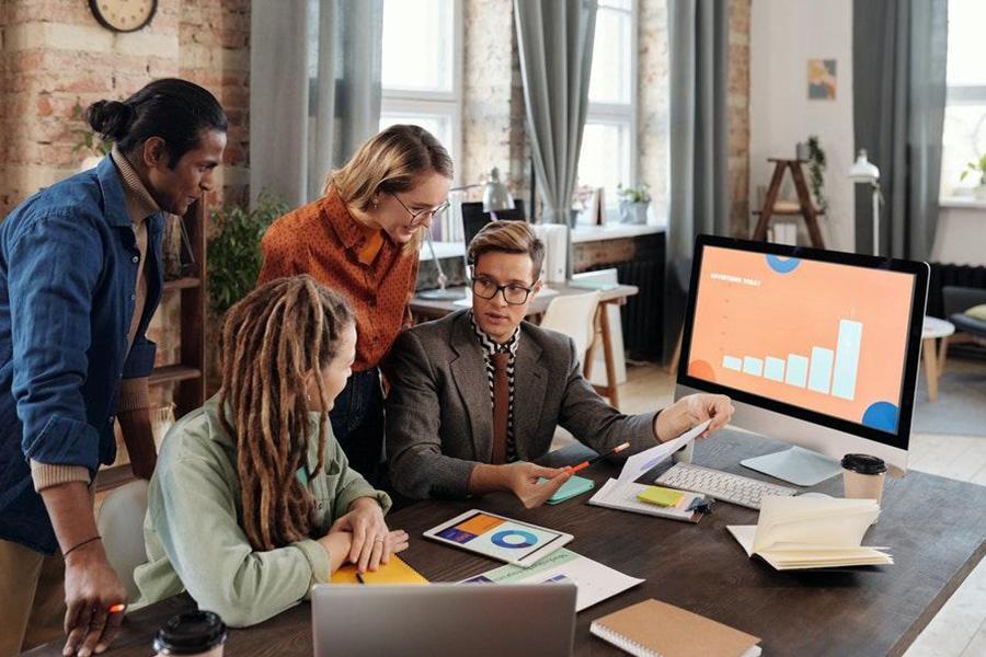 Business people with a screen showing market growth