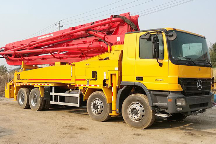 Concrete boom pump mounted on a truck