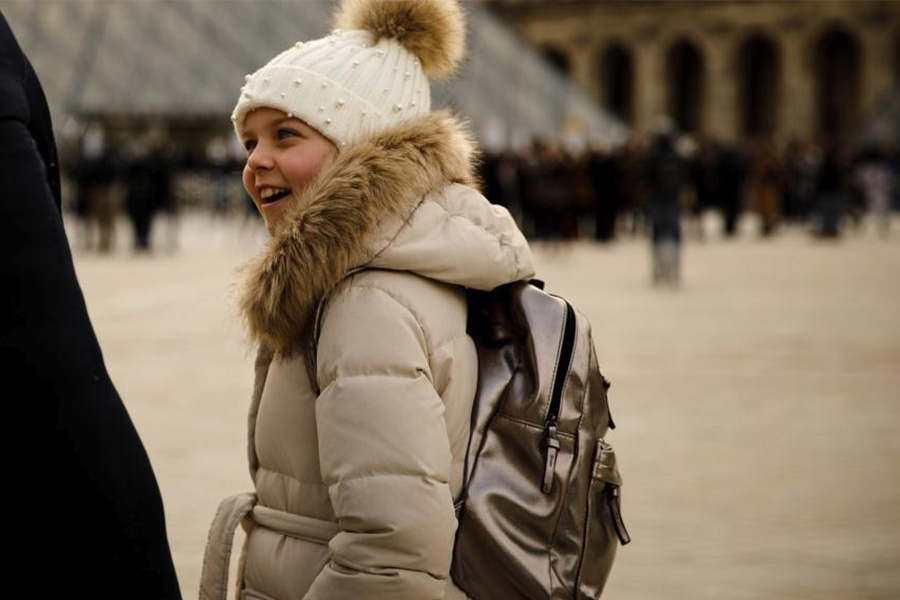 Girl wearing a cream-colored shearling coat