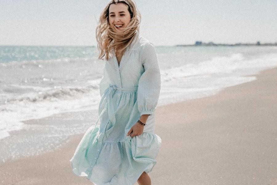 Lady wearing a tranquil blue maxi dress