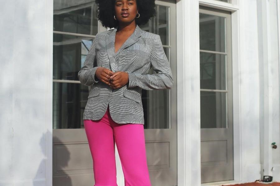 Lady wearing gray blazer and pink guava trousers