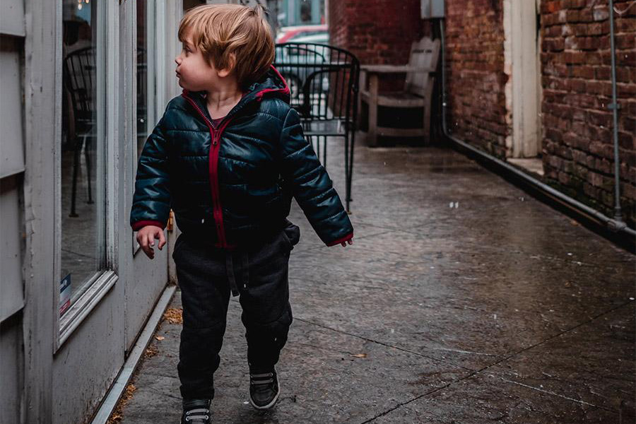 Toddler wearing a dark blue puffer jacket