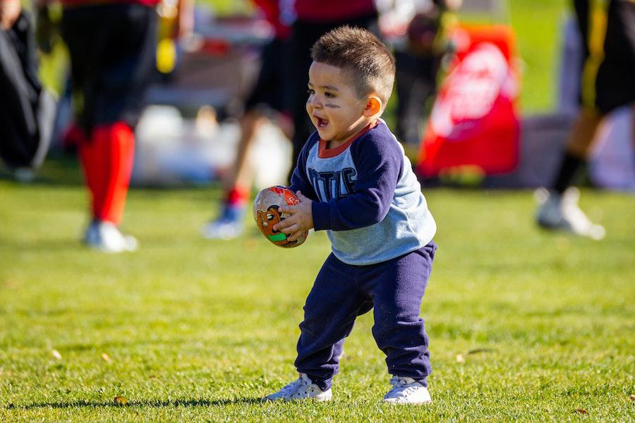 Toddler wearing a rib knit set, holding a ball