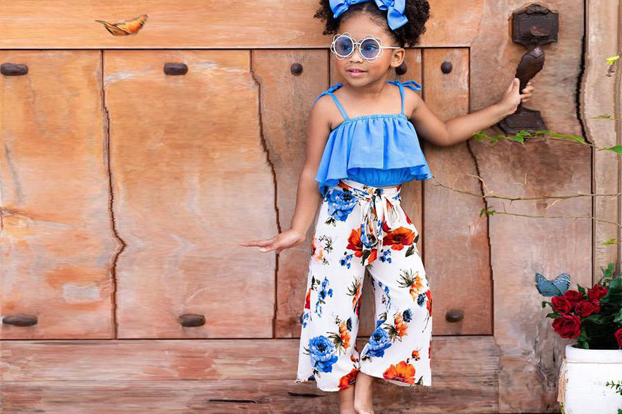 Young girl in floral-print pants