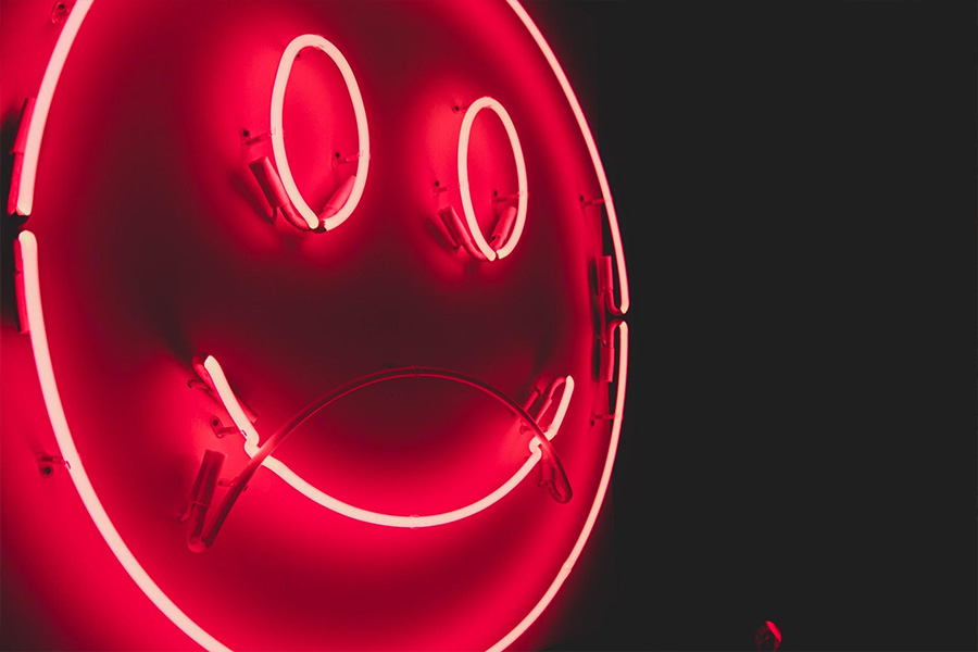 A smiley-shaped LED neon sign