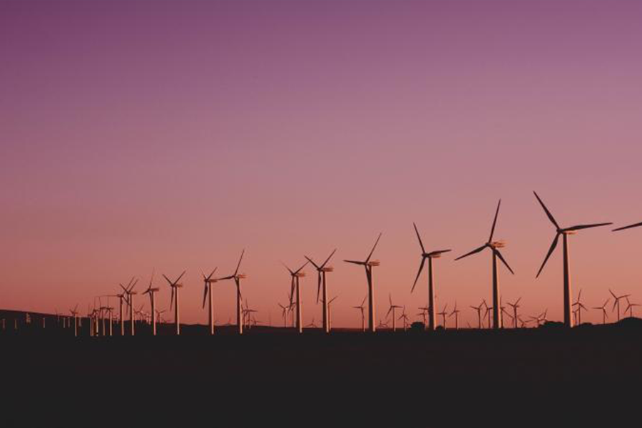 Wind turbines operating during sunset