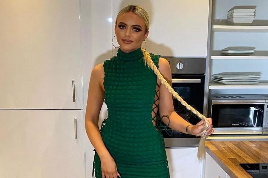 Woman donning a green drawstring bodycon dress