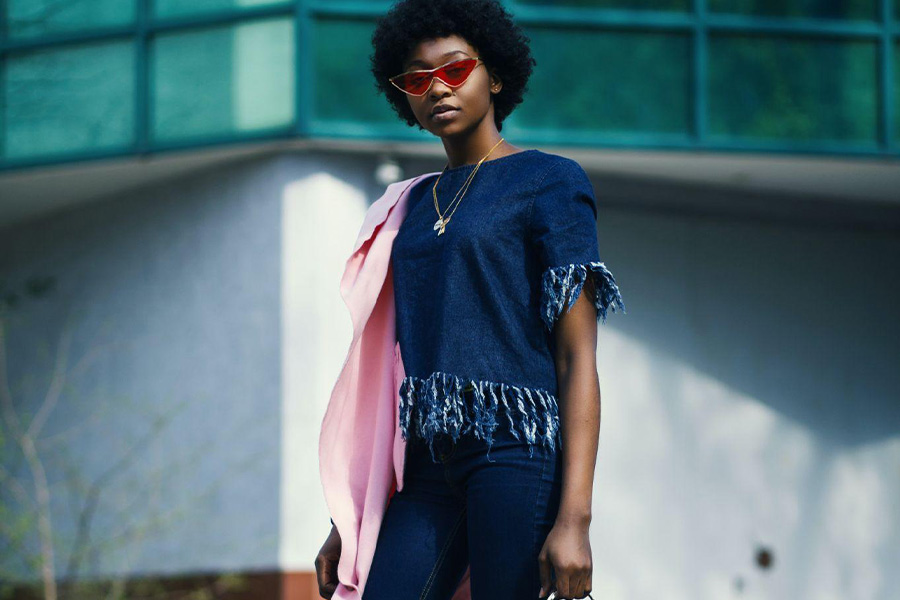 Woman wearing denim jeans and a blue top