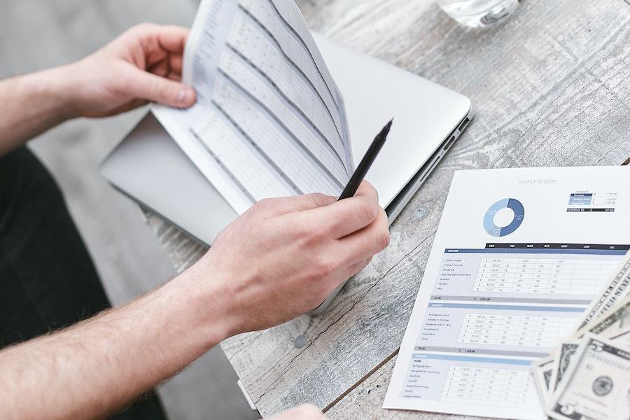 A man reviewing several documents