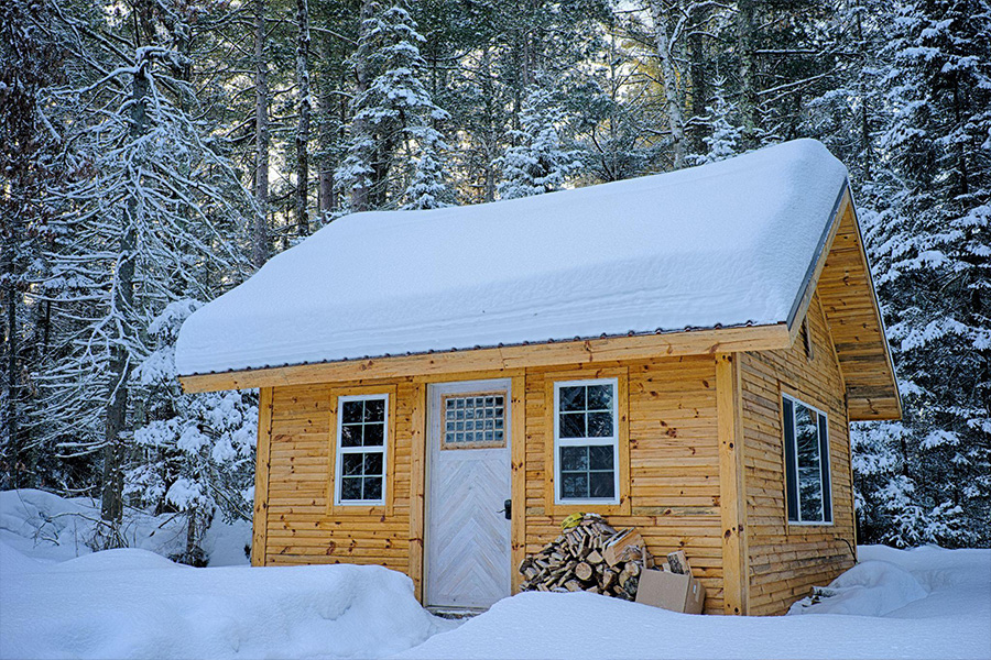 A tiny house cabin made of wooden panels