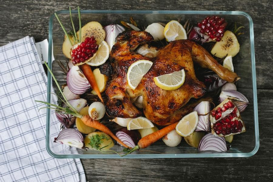 Transparent casserole dish with poultry and other ingredients