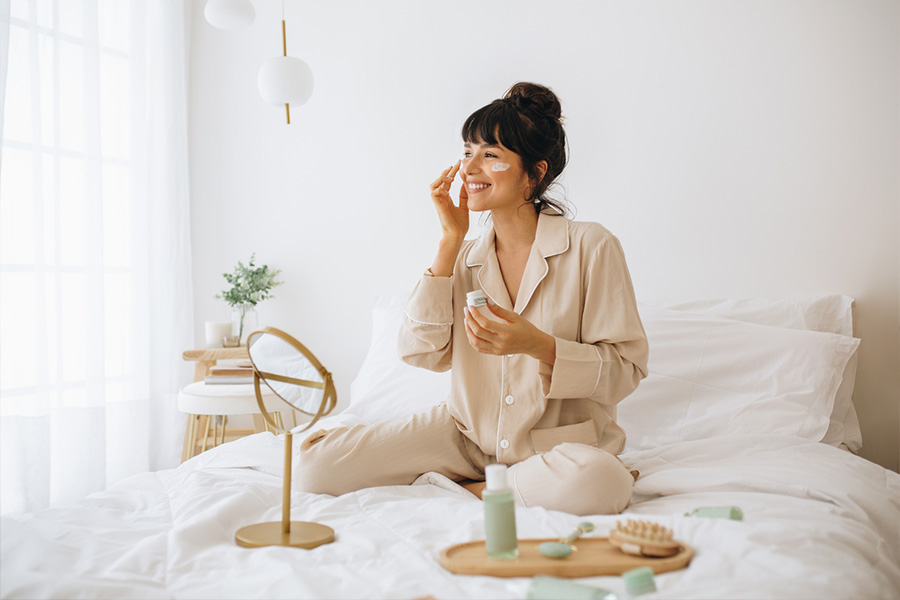 Woman performing skincare routine at home