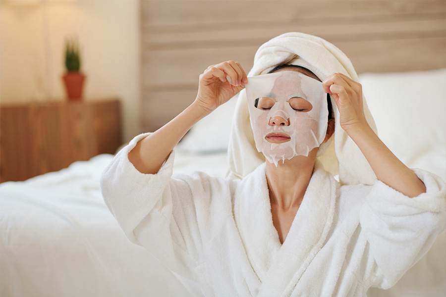 Woman wearing a sheet mask