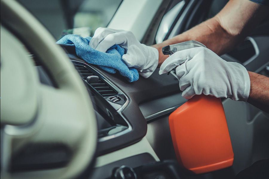 A man holding a cleaning product