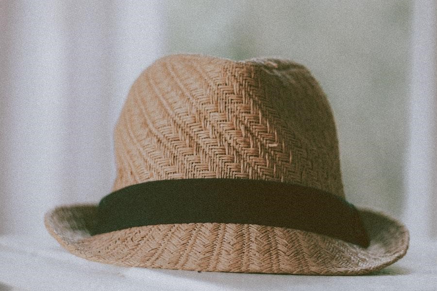 A straw hat with a black ribbon