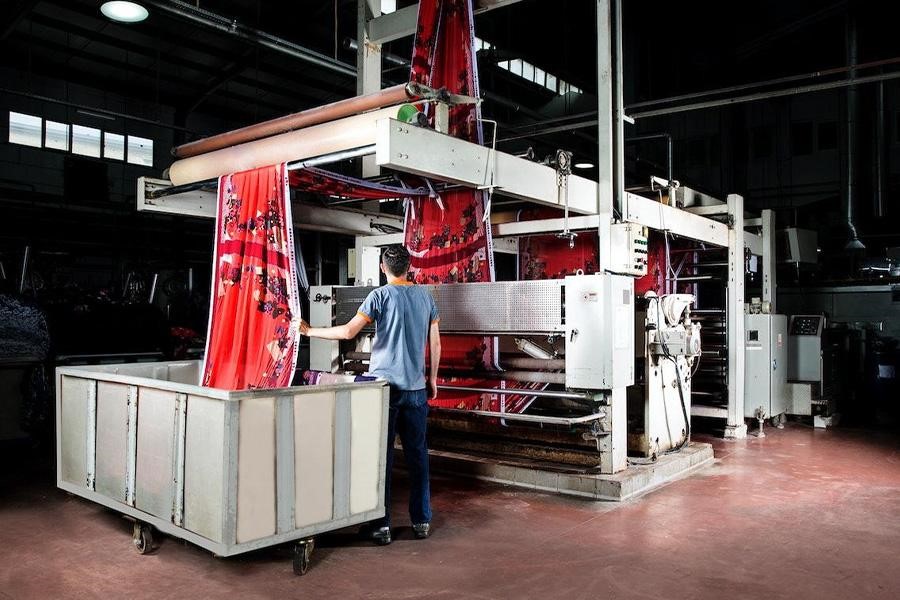 An employee inside a textile manufacturing facility