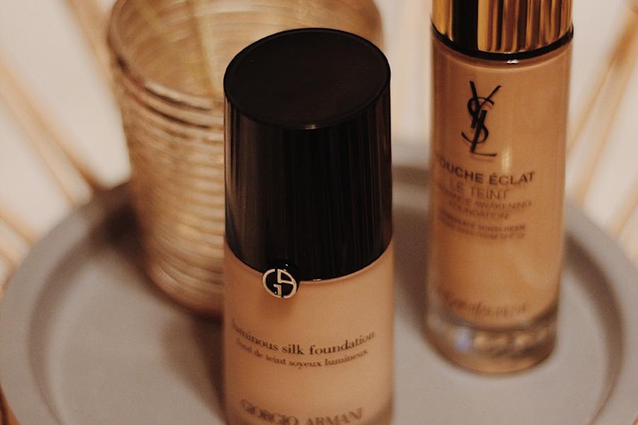 High-end makeup products laid on a countertop