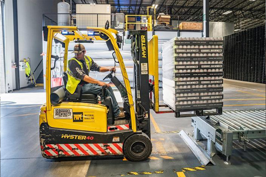 A man driving a Forklift