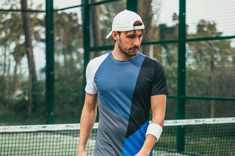 man looking sporty in a snapback trucker hat