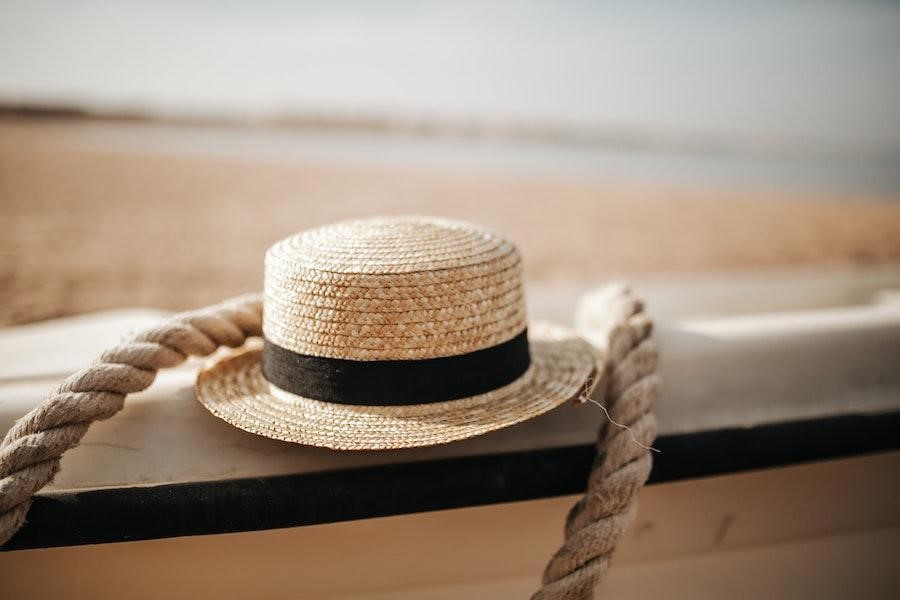 Straw hat paced on a fence