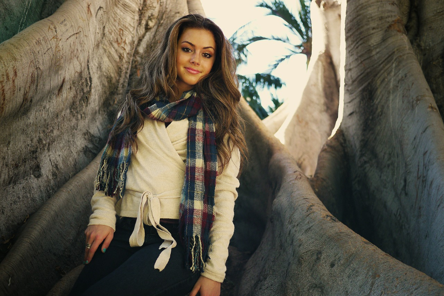 Stylish woman wearing a long scarf