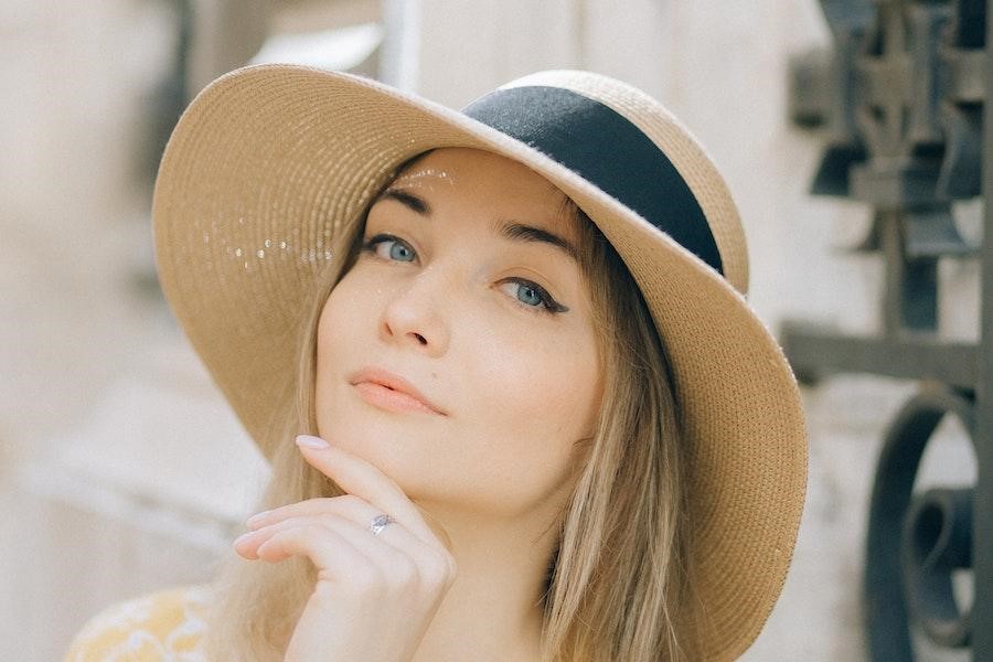 Woman rocking a wide-brimmed straw hat