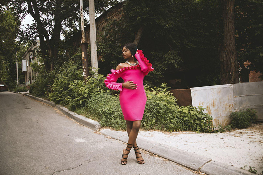 A girl wearing a hot pink bodycon dress