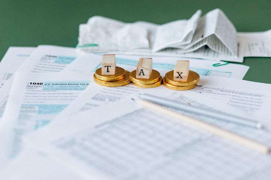 A pile of tax documents on a table