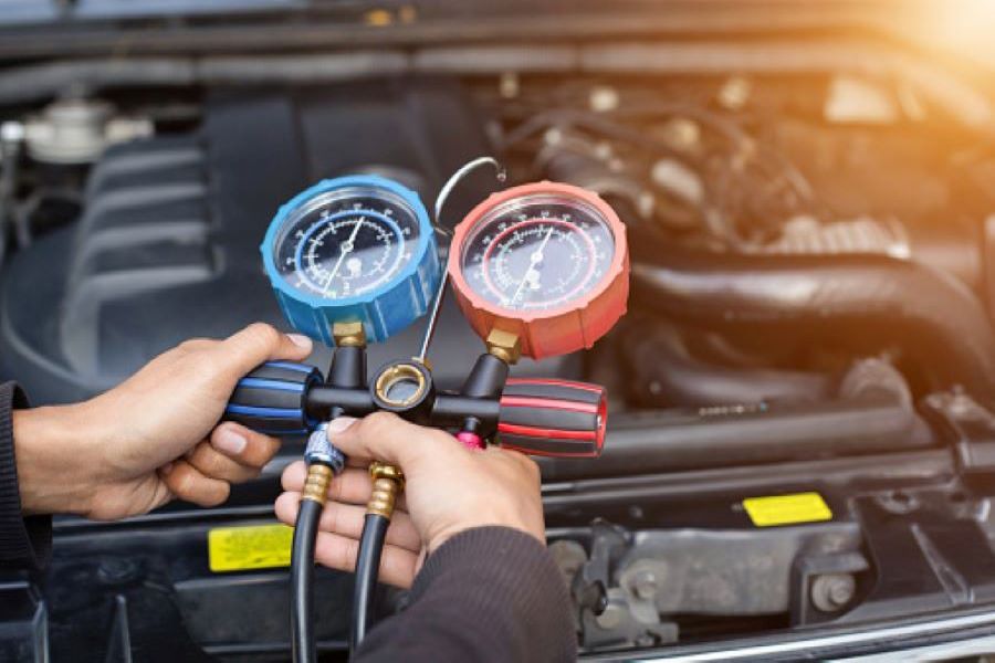 A technician diagnosing a vehicle engine